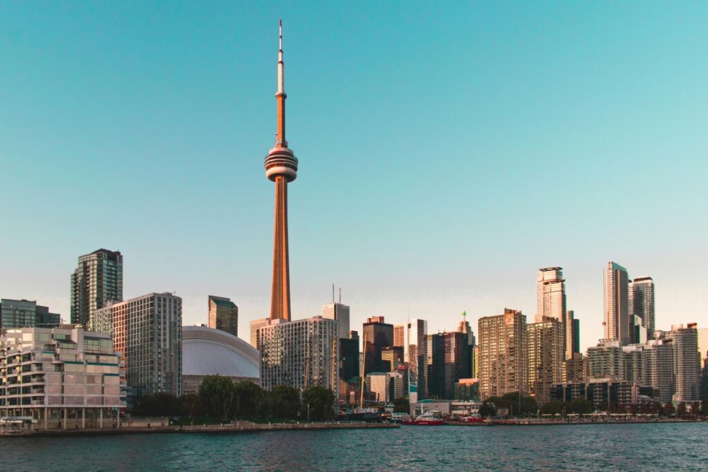 This image showcases the iconic skyline of Toronto, Canada, with the CN Tower standing tall and prominent. The tower's distinct structure rises above a cluster of modern buildings, while the waterfront below adds a serene touch to the urban scene. For businesses looking to "Boost Your Business with Facebook Ads in Canada A Comprehensive Guide", if you're in the tourism, hospitality, or real - estate sectors in Canada, using an image like this in your Facebook ads can be impactful. Highlight the allure of Toronto as a destination or a place to invest. Use relevant hashtags such as #TorontoSkyline, #CNTower, #CanadianCities, and target your ads to users interested in Canadian urban life, travel, or property. This can help increase visibility and engagement, driving more traffic to your business and potentially boosting sales.