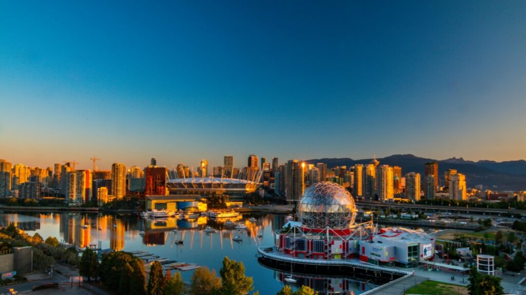 Vibrant Vancouver skyline at twilight,featuring the iconic Science World,with mountains in the distance."How to Make Money on Bigo Live:A Comprehensive Guide"for Canadian content creators looking to monetize their live streams.